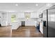 Modern kitchen with white cabinets, stainless steel appliances, and an island at 240 Thornton Dr, Fayetteville, GA 30214