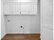 Functional laundry room with cabinet storage and essential hookups at 240 Thornton Dr, Fayetteville, GA 30214