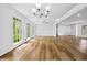 Spacious living room with multiple windows and beautiful wood floors at 240 Thornton Dr, Fayetteville, GA 30214