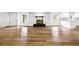 Spacious living room with hardwood floors, a fireplace, and built-in shelving creates a cozy atmosphere at 240 Thornton Dr, Fayetteville, GA 30214