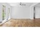 Bright living room with large windows, hardwood floors, and neutral wall colors at 240 Thornton Dr, Fayetteville, GA 30214