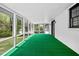 Cozy sunroom with ample windows provides bright natural light and views of the outdoors at 240 Thornton Dr, Fayetteville, GA 30214