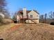A two-story home featuring a deck and a spacious backyard at 46 Norman Rd, Covington, GA 30014