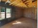 Unfinished room with insulation and exposed wood beams at 46 Norman Rd, Covington, GA 30014