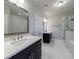 Spacious bathroom with double vanities, glass shower, and soaking tub at 5010 Towneship Creek Rd, Roswell, GA 30075