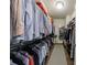 Walk-in closet with custom shelving and ample storage space for clothing at 5010 Towneship Creek Rd, Roswell, GA 30075