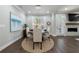 Cozy dining area featuring a round table, stylish decor, and an open layout at 5010 Towneship Creek Rd, Roswell, GA 30075