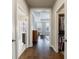 Hallway view into primary bedroom and en-suite bathroom and walk-in closet at 5010 Towneship Creek Rd, Roswell, GA 30075