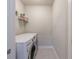 Laundry room with tile floor, shelving, and modern appliances at 5010 Towneship Creek Rd, Roswell, GA 30075