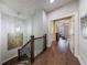 View of staircase with modern chandelier that leads into a bedroom at 5010 Towneship Creek Rd, Roswell, GA 30075