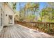 Wooden back deck overlooking a lush yard with mature trees and landscaping at 5145 Southlake Dr, Alpharetta, GA 30005