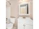 Traditional white bathroom featuring a sink, toilet, and shower with neutral-colored walls at 5145 Southlake Dr, Alpharetta, GA 30005