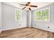 Bedroom with wood look floors and a ceiling fan with a light at 5145 Southlake Dr, Alpharetta, GA 30005
