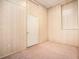 Bedroom featuring carpet, painted wood paneling, and a white door and trim at 5145 Southlake Dr, Alpharetta, GA 30005