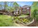 Beautiful brick home with a professionally landscaped front yard and retaining wall at 5145 Southlake Dr, Alpharetta, GA 30005
