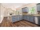 Stylish kitchen with stainless steel appliances, granite countertops and open to living space at 5145 Southlake Dr, Alpharetta, GA 30005