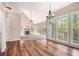 Open floor plan with fireplace, hardwood floors, many windows, and vaulted ceilings at 5145 Southlake Dr, Alpharetta, GA 30005