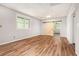 Living room with wood look floors and a sliding barn door leading to another room at 5145 Southlake Dr, Alpharetta, GA 30005