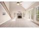 Spacious living room featuring a fireplace and large windows for ample natural light at 5145 Southlake Dr, Alpharetta, GA 30005