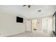 Bright main bedroom features a ceiling fan, tray ceiling, and ensuite bathroom at 5145 Southlake Dr, Alpharetta, GA 30005
