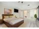 Spacious main bedroom boasts a tray ceiling, TV, and access to a bathroom at 5145 Southlake Dr, Alpharetta, GA 30005