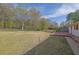 Expansive backyard featuring a spacious deck and mature trees at 6690 Pine Ridge Cir, Cumming, GA 30041