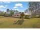 Picturesque backyard with mature trees, expansive lawn, and charming home at 6690 Pine Ridge Cir, Cumming, GA 30041