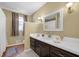 Bathroom vanity featuring dark wood cabinets and a white countertop at 6690 Pine Ridge Cir, Cumming, GA 30041