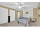 Bedroom with soft color palette, carpet, and a ceiling fan at 6690 Pine Ridge Cir, Cumming, GA 30041