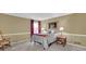 Neutral bedroom is bright and includes a large window at 6690 Pine Ridge Cir, Cumming, GA 30041