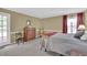 Neutral bedroom features a soft color palette and carpet flooring at 6690 Pine Ridge Cir, Cumming, GA 30041