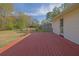Stained wooden deck perfect for outdoor entertaining and relaxation at 6690 Pine Ridge Cir, Cumming, GA 30041