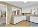 Charming kitchen with light wooden floors, stainless steel appliances, and ample storage at 6690 Pine Ridge Cir, Cumming, GA 30041