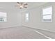 Spacious bedroom with carpet, recessed lighting, and windows, offering comfort and ample natural light at 4212 Adler Cir, Buford, GA 30519