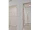 Bedroom features large closet and entrance to bathroom with modern flooring and neutral paint at 4212 Adler Cir, Buford, GA 30519