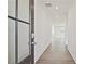 Bright hallway featuring hardwood floors and a clear view through to the well-lit rooms at 4212 Adler Cir, Buford, GA 30519