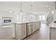 Contemporary kitchen featuring a large island, stainless steel appliances, and an open layout at 4212 Adler Cir, Buford, GA 30519
