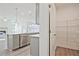 Modern kitchen with island, stainless appliances, and pantry, designed for culinary enthusiasts at 4212 Adler Cir, Buford, GA 30519