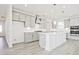 Modern kitchen with a center island, stainless steel appliances, and stylish pendant lighting at 4212 Adler Cir, Buford, GA 30519
