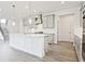 Bright, modern kitchen with a large island, stainless appliances, and ample cabinet space at 4212 Adler Cir, Buford, GA 30519