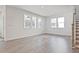 Bright, open-concept living space with beautiful hardwood floors and plenty of natural light at 4212 Adler Cir, Buford, GA 30519