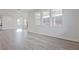Bright living space with fireplace and hardwood flooring, seamlessly connected to the outdoors at 4212 Adler Cir, Buford, GA 30519