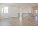 Open loft space with new flooring and modern railing, perfect for relaxing or entertaining guests at 4212 Adler Cir, Buford, GA 30519