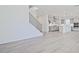 Open-concept space featuring hardwood floors that connects the living area to the kitchen at 4212 Adler Cir, Buford, GA 30519