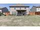 Large backyard featuring a covered patio, lawn, and privacy fence provides ample space for recreation and relaxation at 4685 Orchard View Way, Cumming, GA 30028