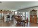 Open kitchen with a dining area, granite counters, stainless appliances, and ample cabinet space at 4685 Orchard View Way, Cumming, GA 30028