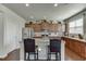 Modern kitchen featuring granite countertops, stainless steel appliances, and a breakfast bar at 4685 Orchard View Way, Cumming, GA 30028