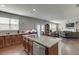 Bright kitchen with a large island, granite countertops, stainless appliances, and an open layout at 4685 Orchard View Way, Cumming, GA 30028