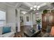 Bright living room featuring hardwood floors, coffered ceilings, and an open layout at 4685 Orchard View Way, Cumming, GA 30028