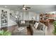 Open-concept living room flowing into the kitchen and dining area with hardwood floors and ample space at 4685 Orchard View Way, Cumming, GA 30028